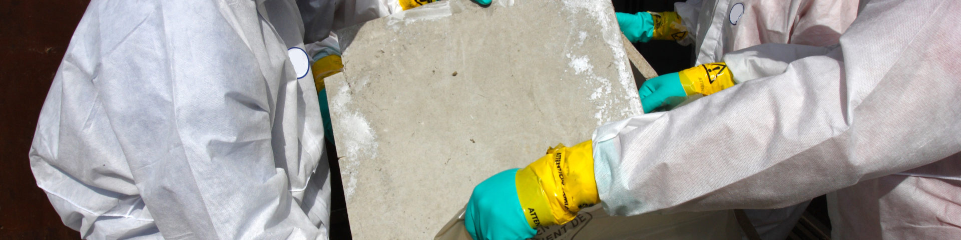 Removing materials containing some asbestos.