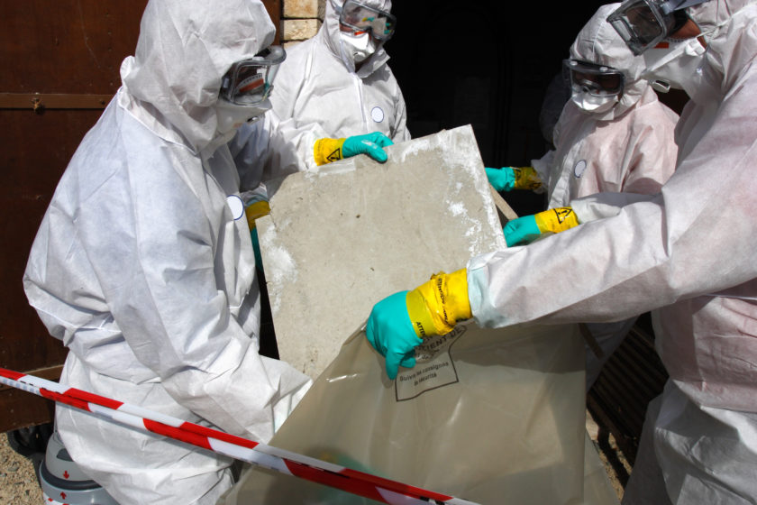 Removing materials containing some asbestos.